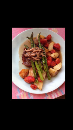 NY Steak, grilled asparagus, roasted Cherry Tomatoes, Fingerling potatoes, Mushrooms, and Veal stock reduction